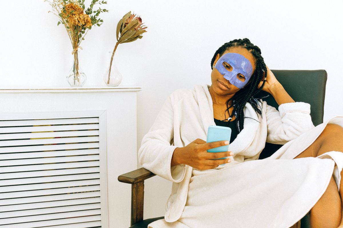 African woman enjoying a skincare ritual